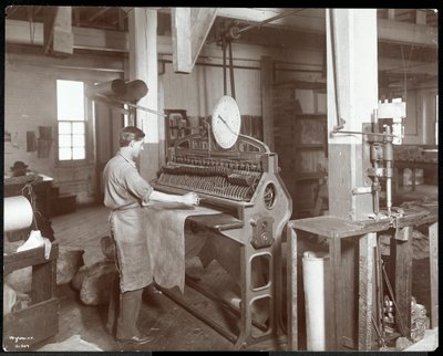 Interior View of a Man Working with Leather at the New York Leather Belting Co., New York, 1906 by Byron Company